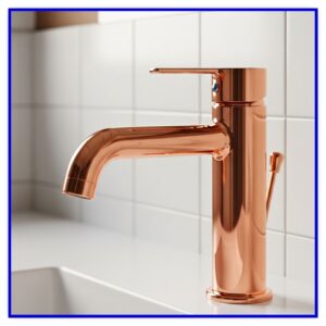 Copper faucet in a bathroom.